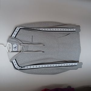 CALVIN KLEIN Performance pull-over hoodie.   Decorated sleeves.  Tied hoodie.